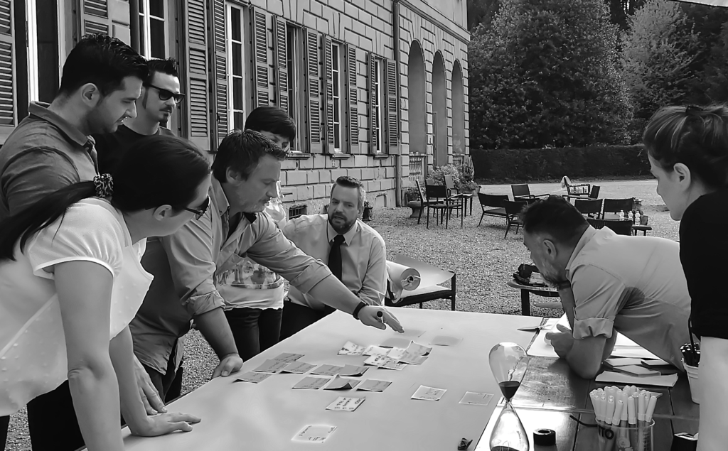 Coach Stefan durante un workshop di leadership con un management team
